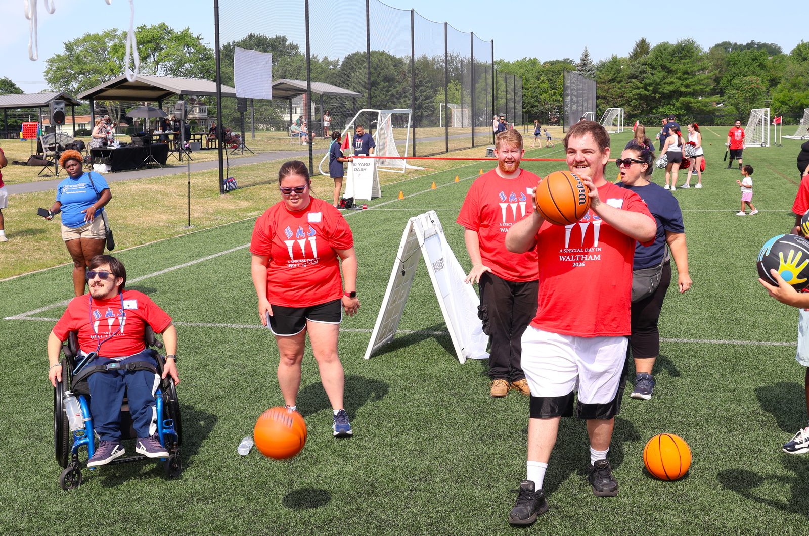 Athletes at the basketball station